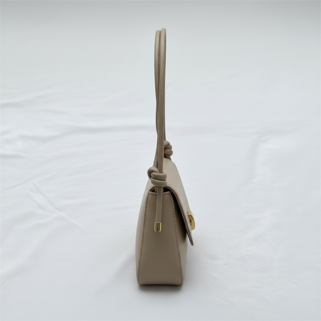 Beige leather shoulder bag side view