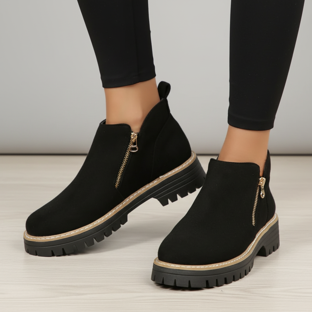 Black boots with grey background
