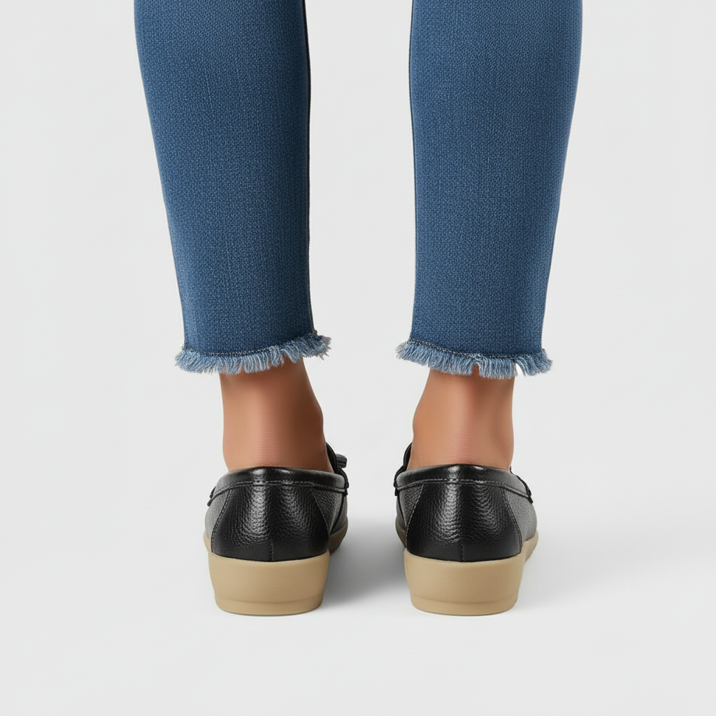 Black leather loafers back view