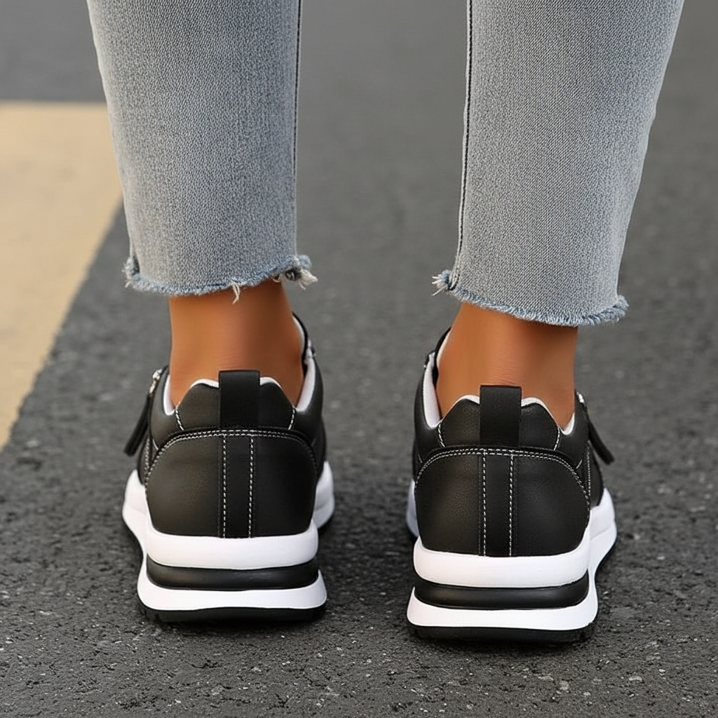 Black leather sneakers back view