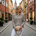 Blonde woman in gray knit polo sweater in Stockholm