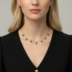 Blonde woman wearing gold necklace with green hearts - single necklace