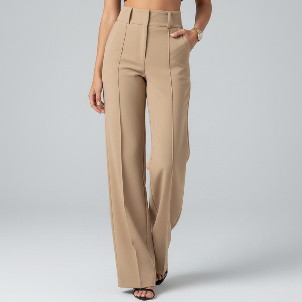 Cropped studio image of beige pants from waist down