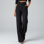 Cropped studio image of black pants from waist down