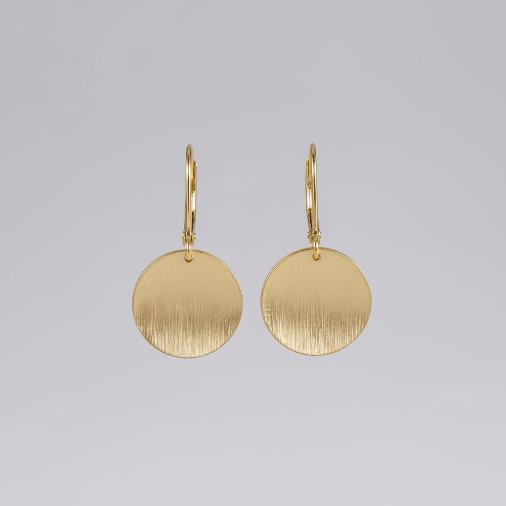Gold teardrop earrings studio shot