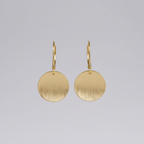 Gold teardrop earrings studio shot