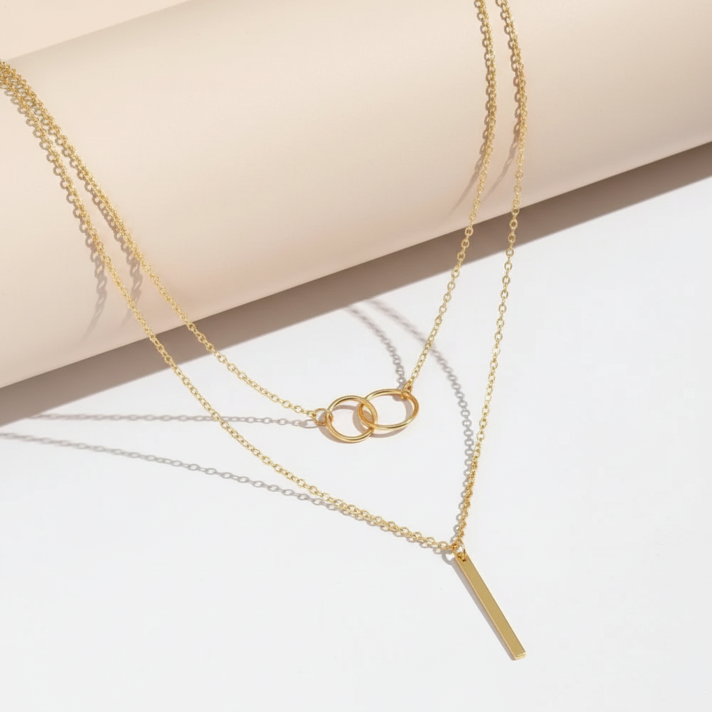 Layered gold necklace flat lay