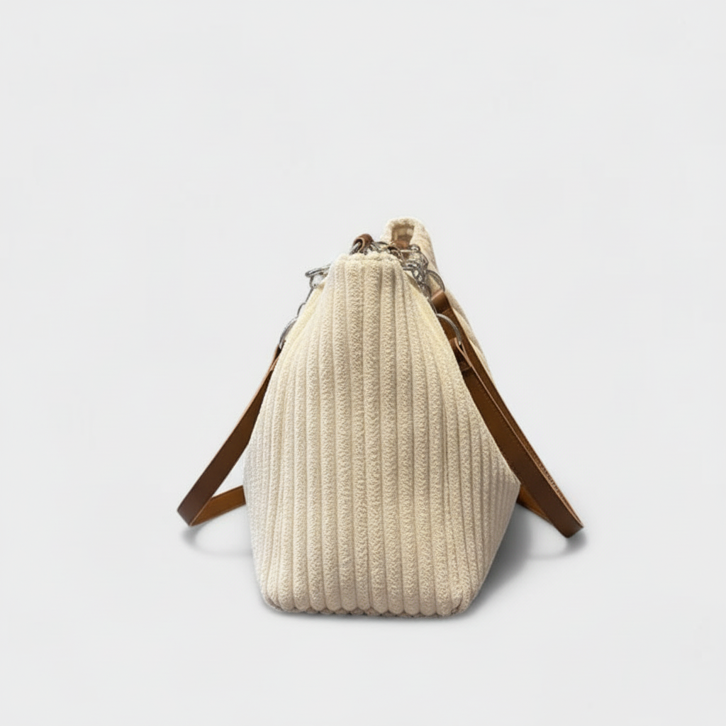 Side view of beige quilted tote bag