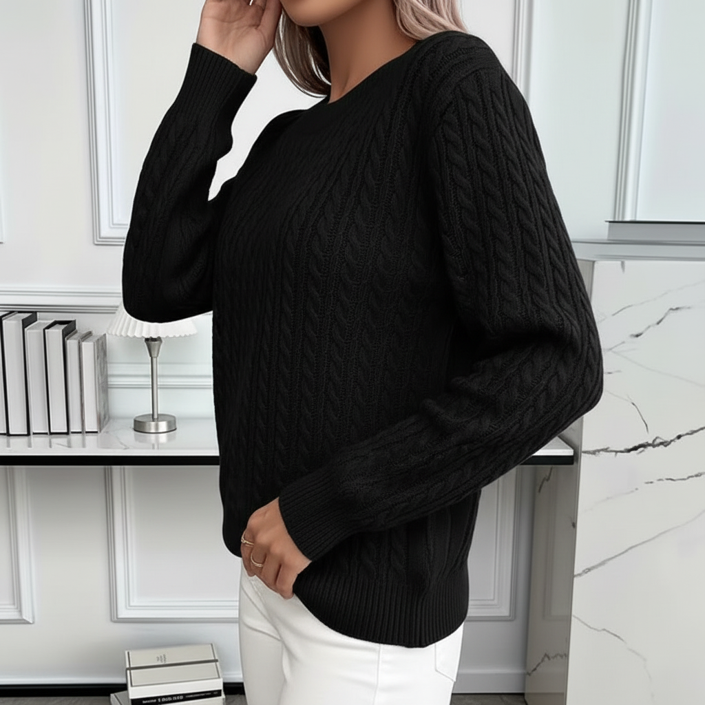 Side view of black cable knit sweater