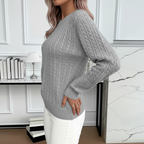 Side view of gray cable knit sweater