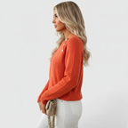 Side view of orange sweater