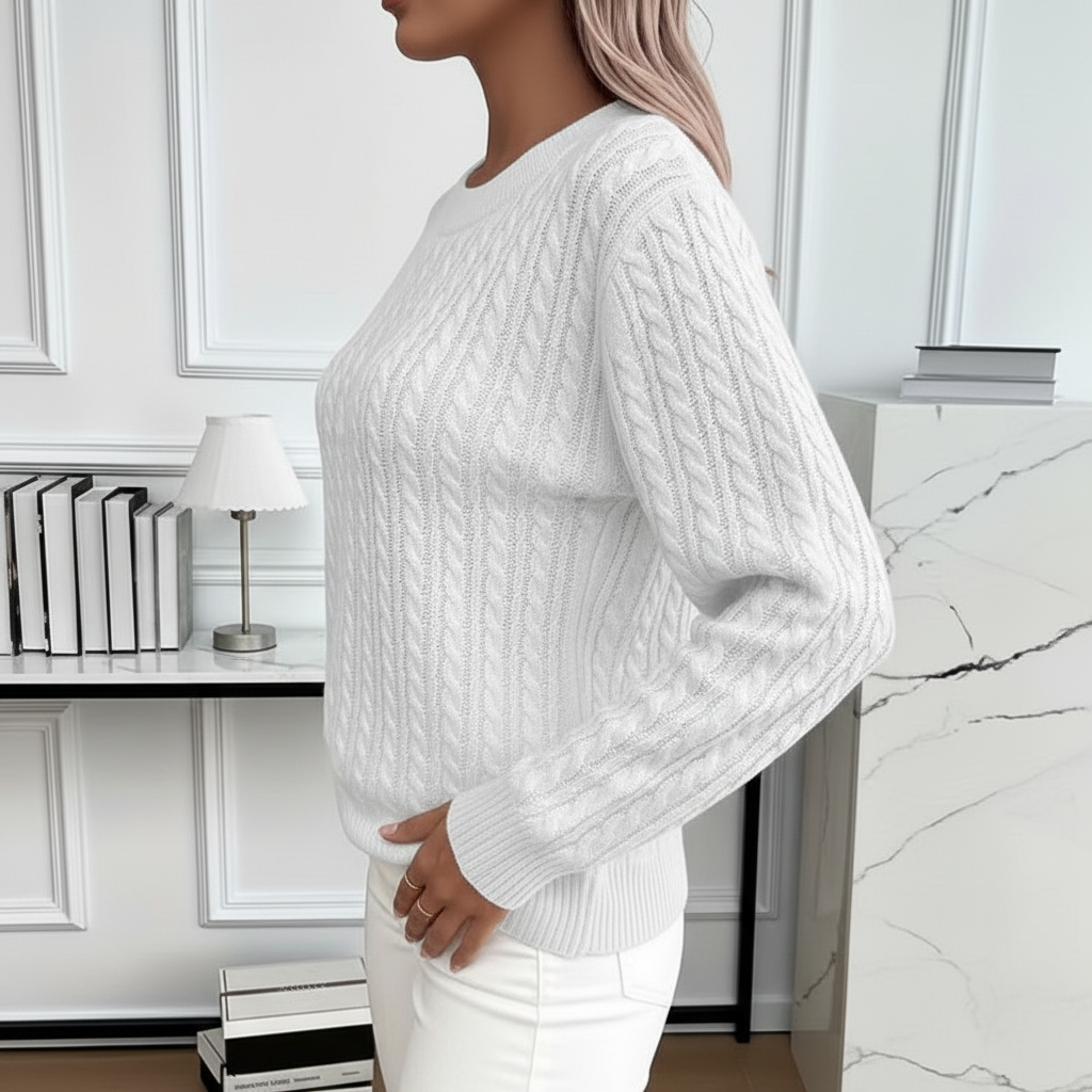 Side view of white cable knit sweater