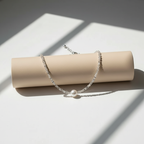 Silver beaded pearl choker on roll