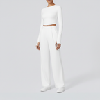 Studio pose – White wide-leg trousers